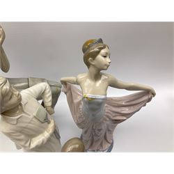 Collection of seven Lladro figures, including Seated ballerina with swan 6204, Childhood Dream 8129, Dancer 5050, reclining clown with ball alongside a selection of other figures. 