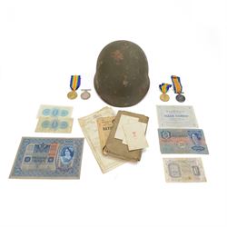 WWI two pairs of medals together with The Soldiers Small Book of Thomas Adams, Kings Message to the RAF, and other military ephemera and a soldiers helmet  