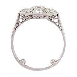 Continental Art Deco platinum nine stone old cut diamond oval panel ring, the central bezel set diamond, with pierced and milgrain set diamond surround, total diamond weight approx 0.95 carat