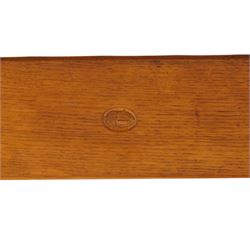 Acornman - adzed oak refectory dining table, rectangular adzed top with rounded corners raised on twin shaped end supports terminating to sledge feet united by pegged stretcher, carved with acorn signature