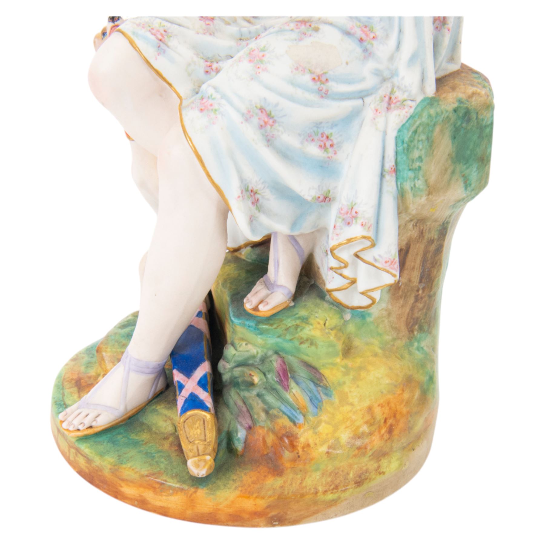  20th century bisque figurine, modelled as Artemis seated upon a rock, with impressed L&M mark beneath, H36cm