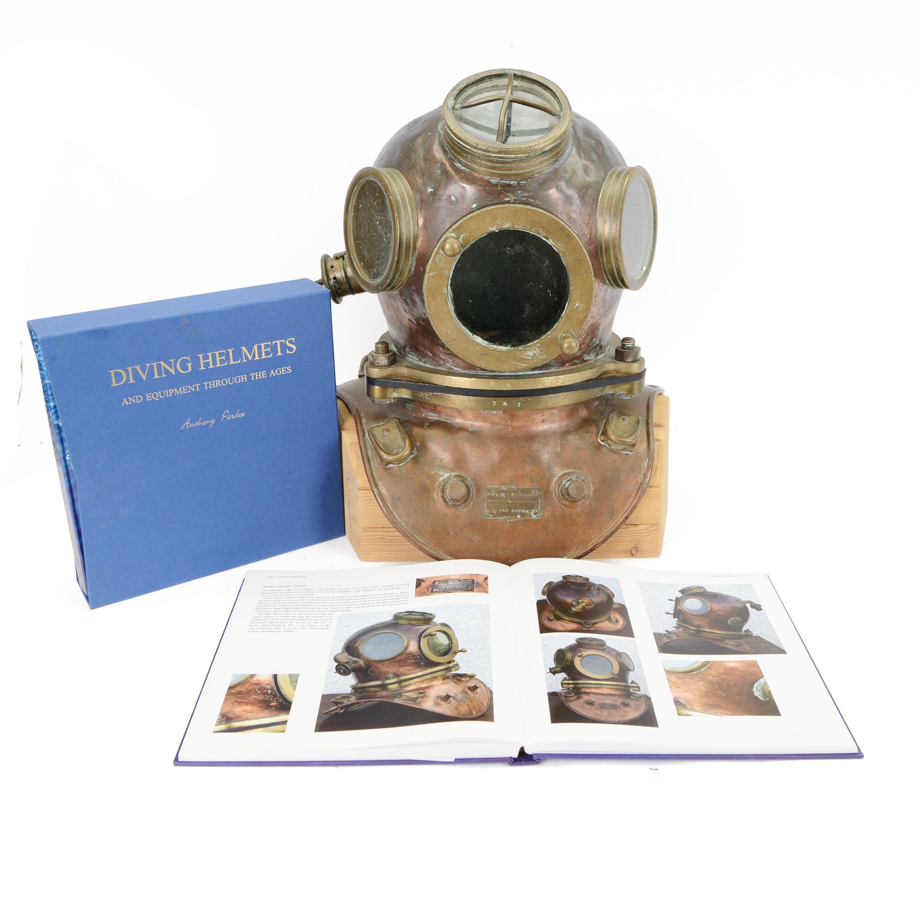 19th century Franz Clouth three bolt copper and brass diving helmet, inscribed 'Franz Clouth Kncinische Gummiwaarenfabrik m b H COLN NIPPES', matching numbers T A 7 on top and corselet rims, with handmade wooden stand, together with a reference book 'Diving Helmets' by Anthony Pardoe, which features the helmet on pages 146 and 147, helmet W42cm, H40cm, H50cm
