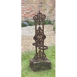 Scrolled and floral cast iron twin plant pot stand on stone base. H204cm. 