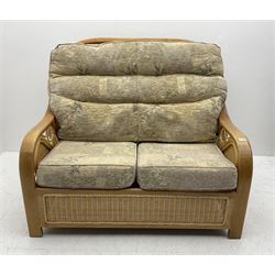 Light wood and cane two seat conservatory sofa, loose beige patterned cushions