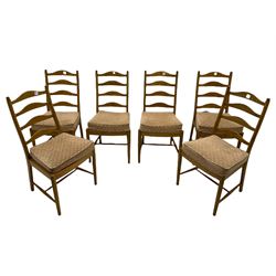 Ercol light elm oval extending dining table, with butterfly leaf, and six ladder back chairs