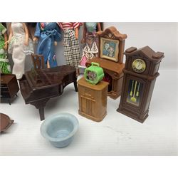 Seven Pippa dolls and a collection of plastic dolls house furniture