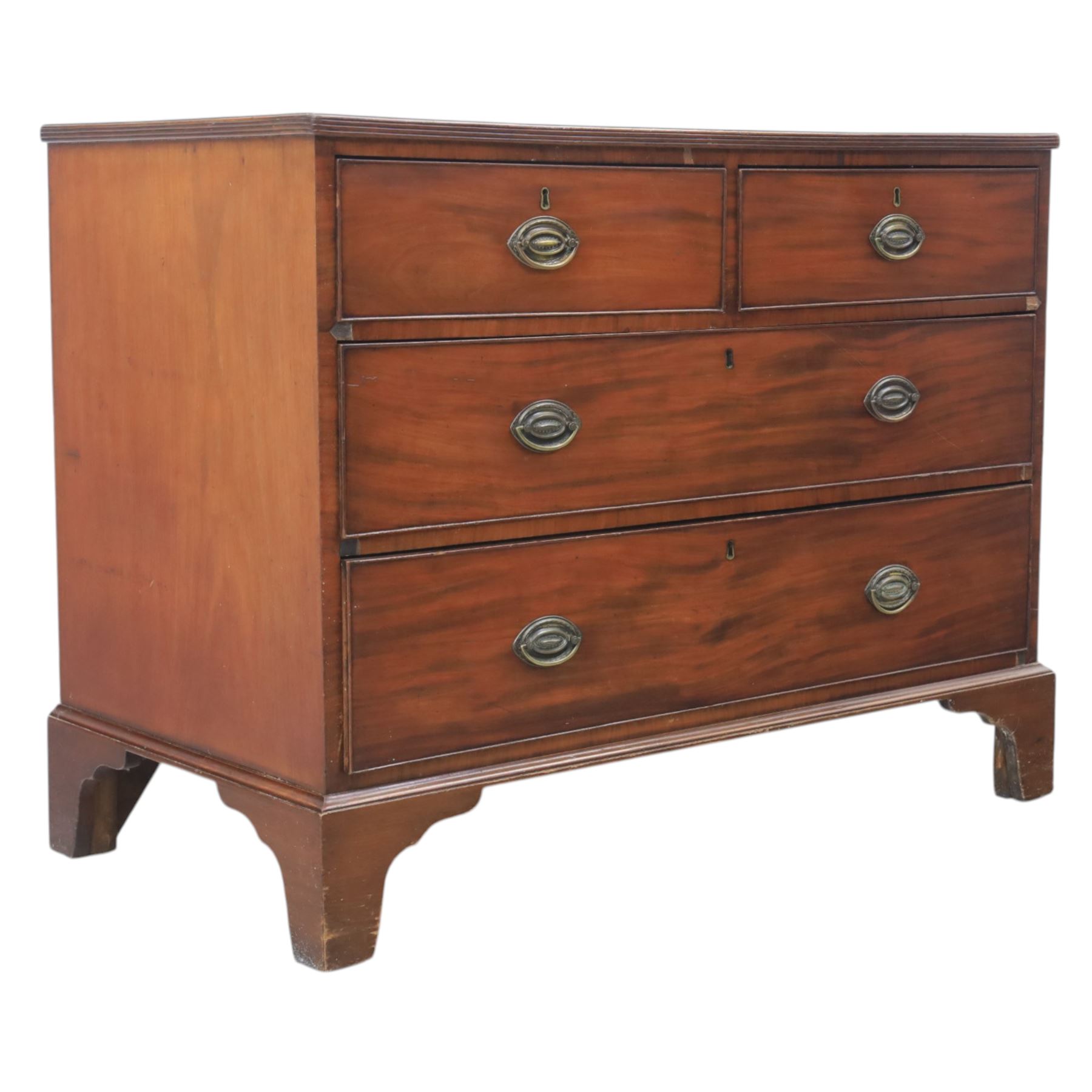 Early 19th century mahogany chest, fitted with short and two long drawers, crossbanded top, raised on bracket feet