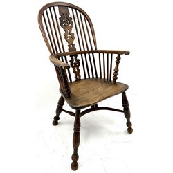 19th century Yorkshire yew and elm Windsor chair, scrolling arms, turned supports joined by crinoline stretchers 
