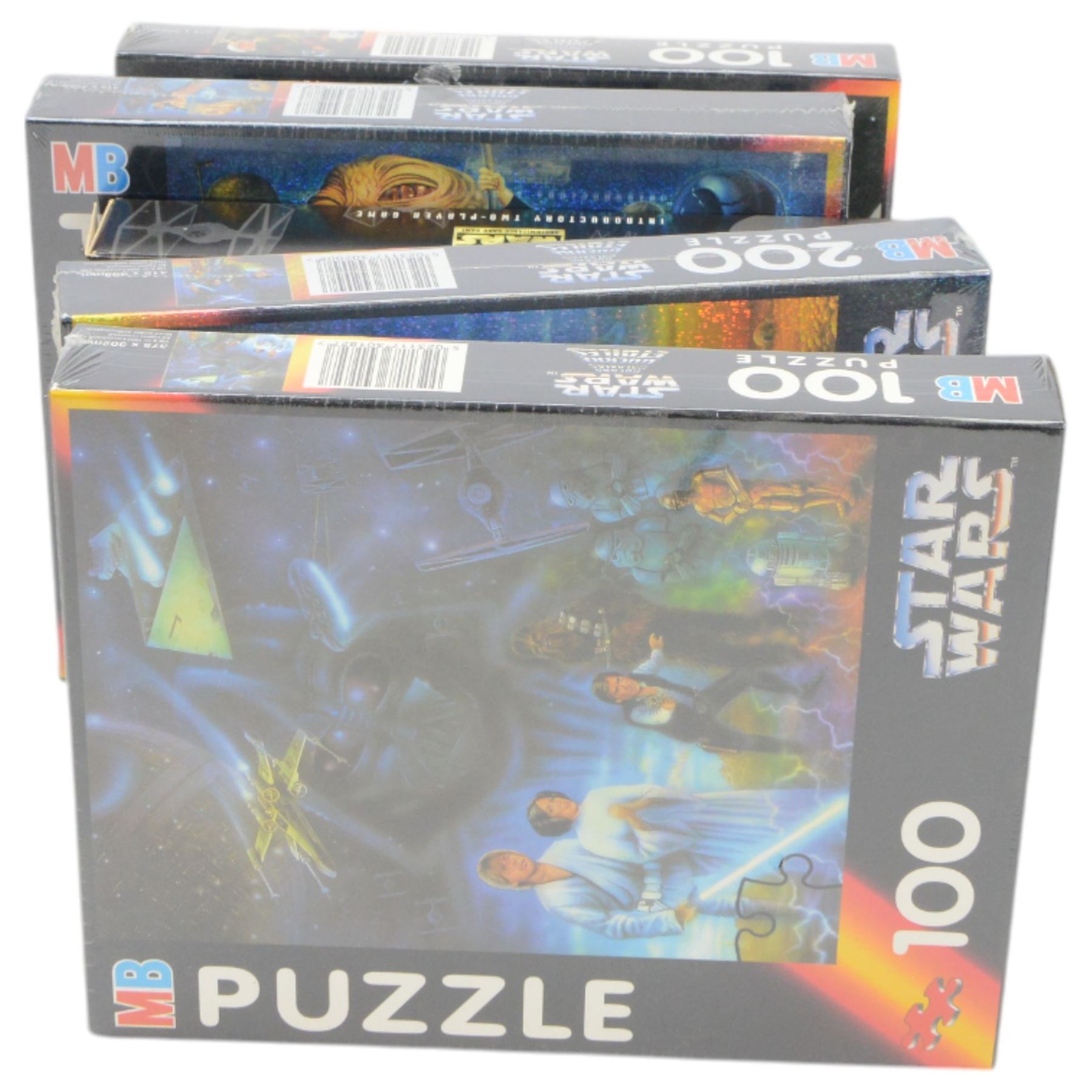 Star Wars puzzles and games, including four sealed MB Games 200piece jigsaw puzzles, two Darth Vader sculpture puzzles, limited edition sealed Ravensburger The Force Awakens Labyrinth game, two Special Edition Star Wars Trilogy Mousemats in original packaging, and a collection of Star Wars The Force Awakens ephemera including tins, flags, 3D glasses, etc