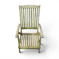 Five piece teak garden dining set, comprising circular folding table and four folding armchairs, with slatted seats and backs in a weathered finish