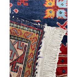 Persian Ardabil indigo ground rug, four interconnected lozenge medallions surrounded by ewer, bird, dragon, camel and geometric motifs, hooked border within guard stripes 