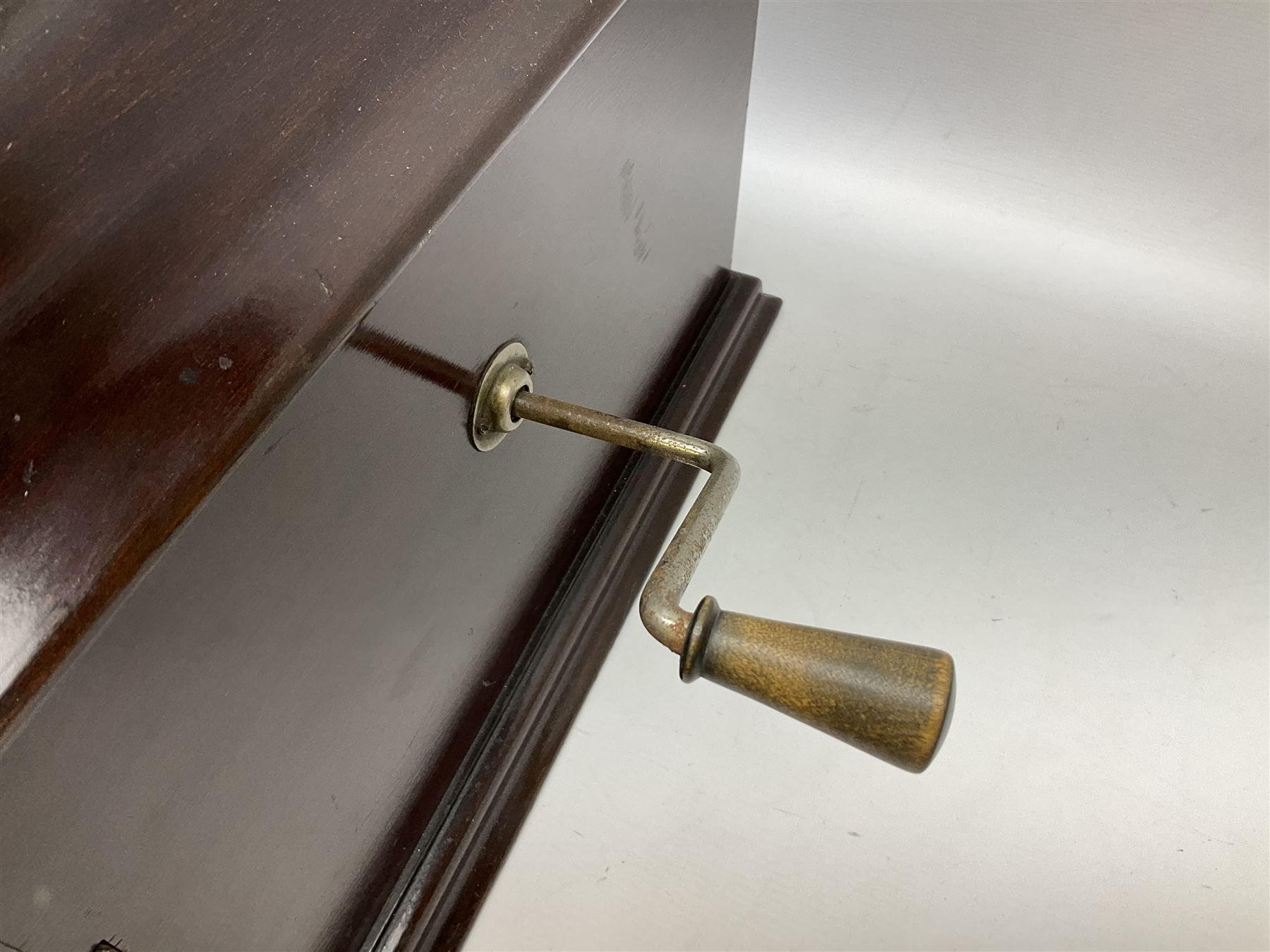 Early 20th century wind up gramophone set in a wooden case with twin door sound hole to the front and tins of 'His Masters Voice' needles