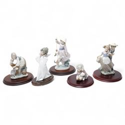 Lladro 'Teasing the Dog' 'Love in Bloom' 'Eskimo playing with Polar Bear' 'Mime Angel' and...