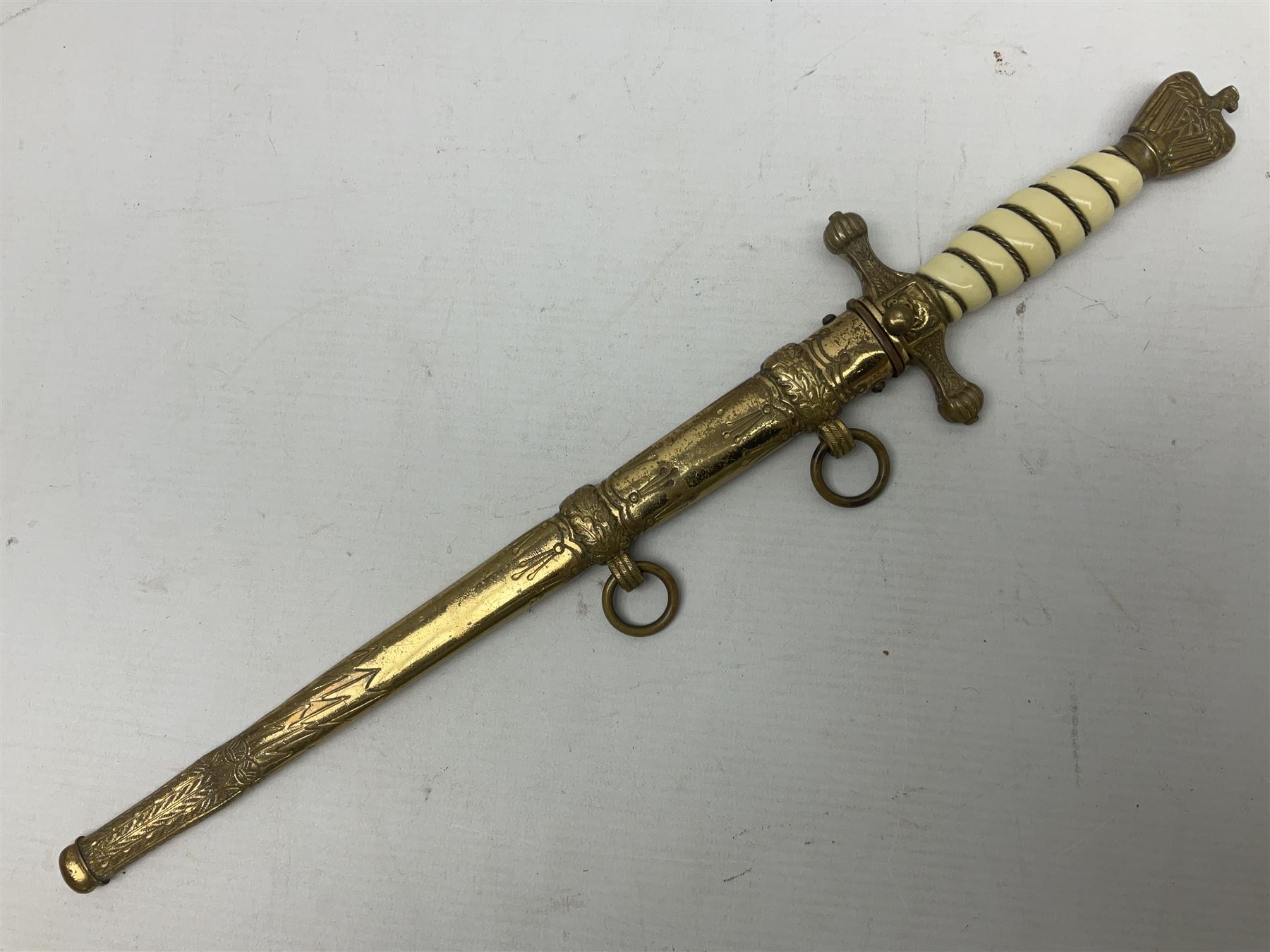 WW2 German kreigsmarine style dagger composed from various age parts, the post-war 25cm double fullered blade  with etched decoration and inscribed WKC with knight's head; in gilt brass scabbard with two rings L42cm overall