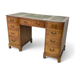 Queen Anne design burr walnut pedestal desk, of serpentine form with green tooled leather ...