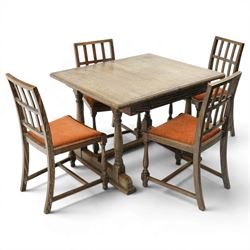 Arts & Crafts limed oak extending dining table, the rectangular draw-leaf top with integra...
