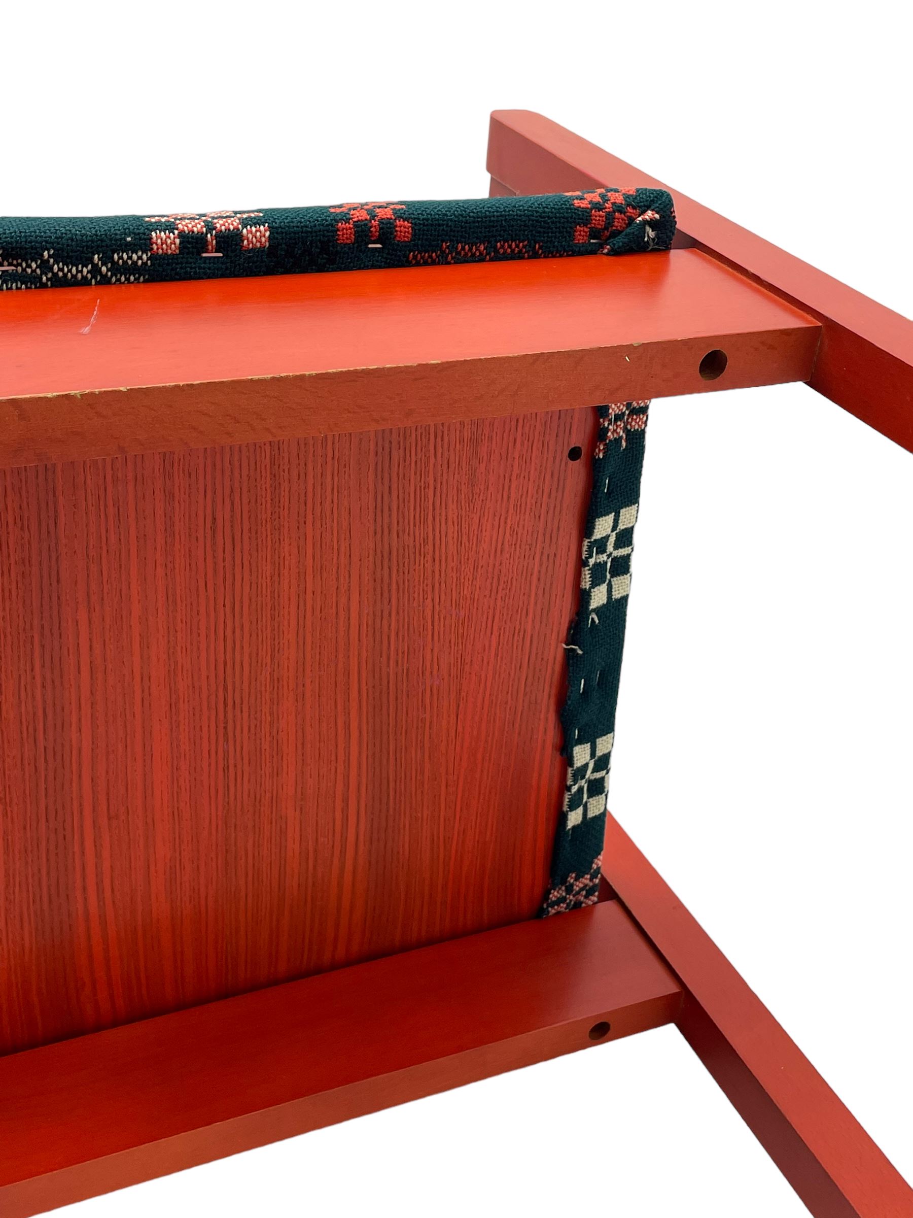 Prince Charles Investiture Chair - designed by Lord Snowdon, manufactured by Remploy, 1969, red finish and decorated with the Prince of Wales's feathers and moto 'Ich Dien' in gilt, later upholstered seat in 1950s design Welsh blanket weave fabric 