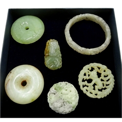 Carved Hetian jade bangle, two carved jade pendants, two circular Celadon jade pendant's and one other 