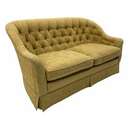 Traditional shaped two seat sofa, upholstered in pale ochre buttoned fabric, feather cushions