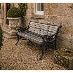 Victorian Andrew McLaren pattern cast iron bench, the ornate ends with detailed scrollwork...