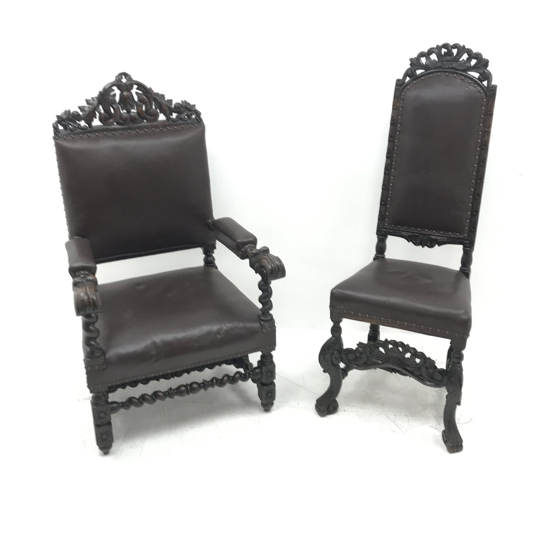 Jacobean style oak library chair, floral carved and pierced cresting rail, upholstered back seat and arms, barley twist supports (W68cm) and a similar oak hall chair, carved cresting rail and supports, upholstered back and seat (W52cm)