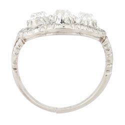 Late 19th / early 20th century platinum diamond ring, three old cut diamonds, in an openwork setting surrounded by further old cut diamonds, with pierced design shoulders, principal three diamonds total weight approx 1.45 carat, in a velvet and silk lined box by Selfridges