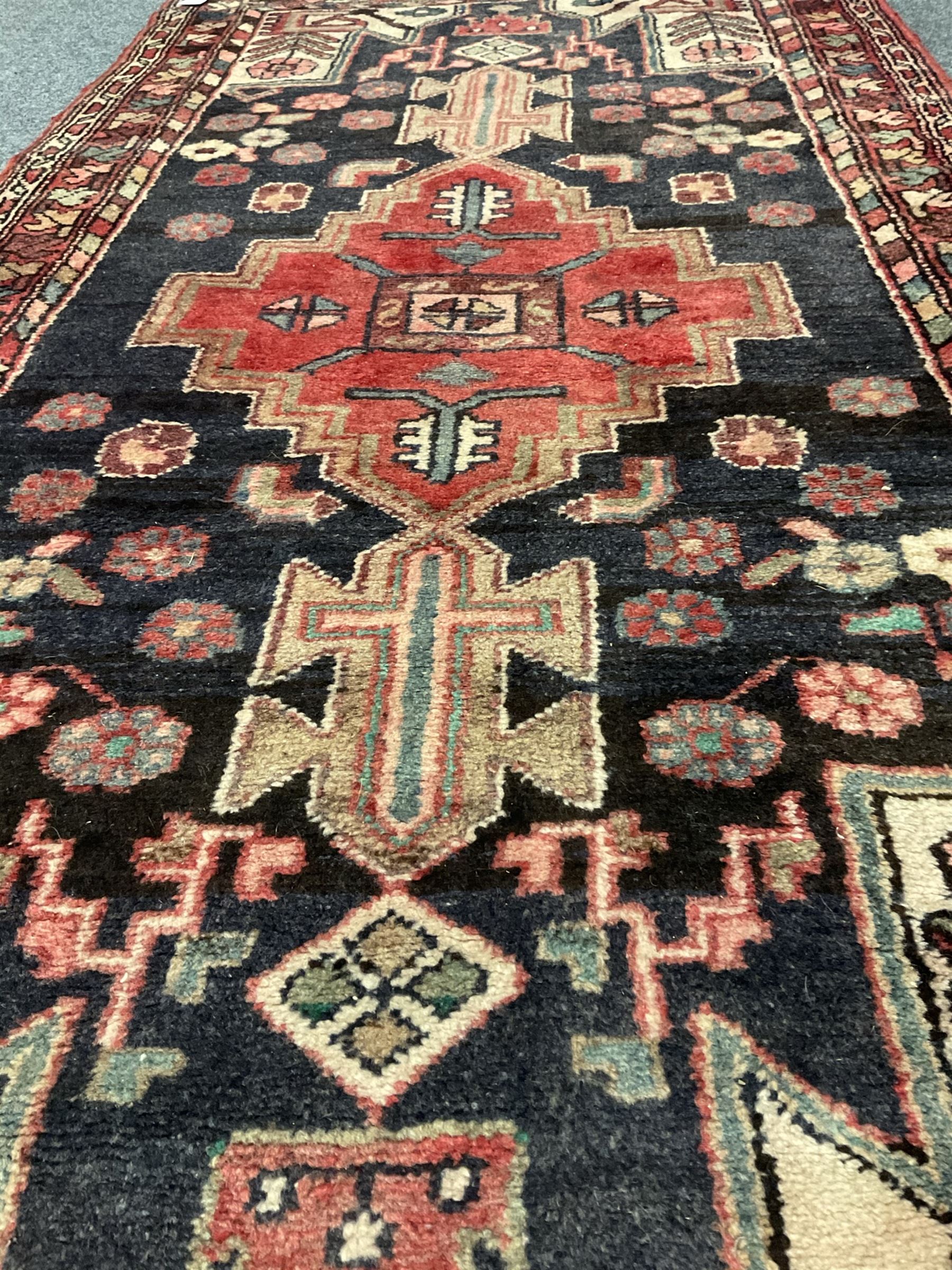Persian red and blue rug, central medallion, geometric shape field