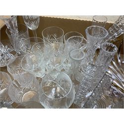 Collection of cut and moulded glassware, to include drinking glasses of various size and form, vases, bowls, decanters, etc., in two boxes 