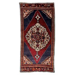 Persian Hamadan rug, hand knotted, central medallion bordered by geometric and intricate f...