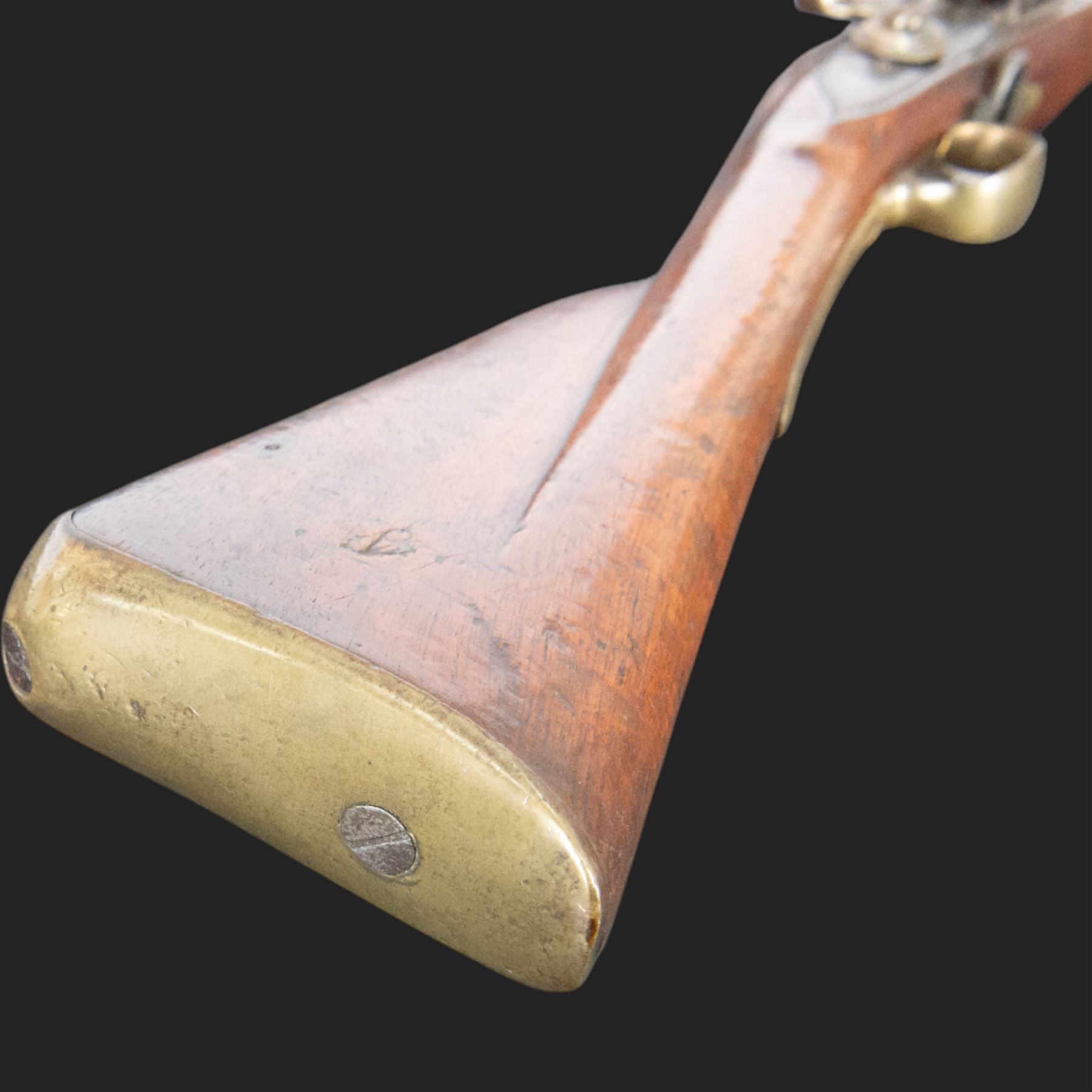 Brown Bess flintlock musket, 37in barrel, action marked with crowned GR and Tower, with brass mounts, the thinned butt marked 38, sling swivels, steel ramrod, overall L132cm
