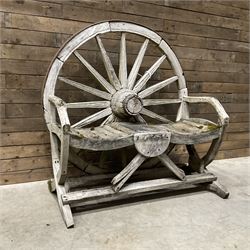 Early 20th century timber framed cartwheel garden bench