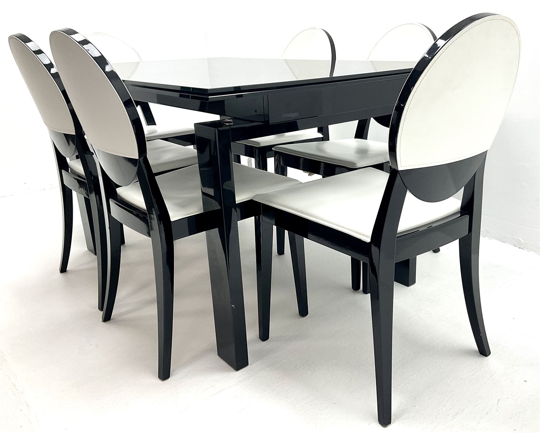 Ponsfords Sheffield Italian black gloss and glass extending dining table, rectangular supports (W220cm & 140cm, H77cm, D90cm) and set six chairs black and white dining chairs (W48cm)