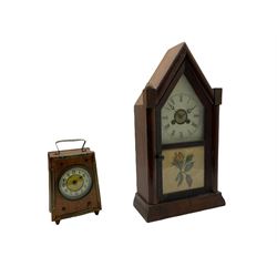 An American “Jerome” late 19th century  30-hour spring driven steeple clock with alarm, in a mahogany case with a decorative glass tablet depicting a rose painted white dial with roman numerals and minute track, steel moon hands and a brass alarm setting disc to the centre. With pendulum and key.
H40 W20 D10
With a small portable 19th century German “Wutternberg” alarm clock, the piece dial with a gilt centre and Ivorine chapter ring, Arabic hours and minute band, wooden case with brass fittings and carrying handle on four feet, wound and set from the rear with integral keys, alarm sounding on a bell. 
H20 W12 D7
