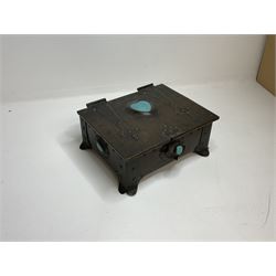 Arts and Crafts copper box, the lid decorated with stylised riveted hinges and inset with Ruskin type ceramic turquoise heart-shaped cabochon, the mount etched M.B 1913, and further cabochon roundel to each side panel, including one inset to the clasp acting as the knob to the locking mechanism, marked RS Douglas 1913 beneath, W16.5cm H7cm D15cm