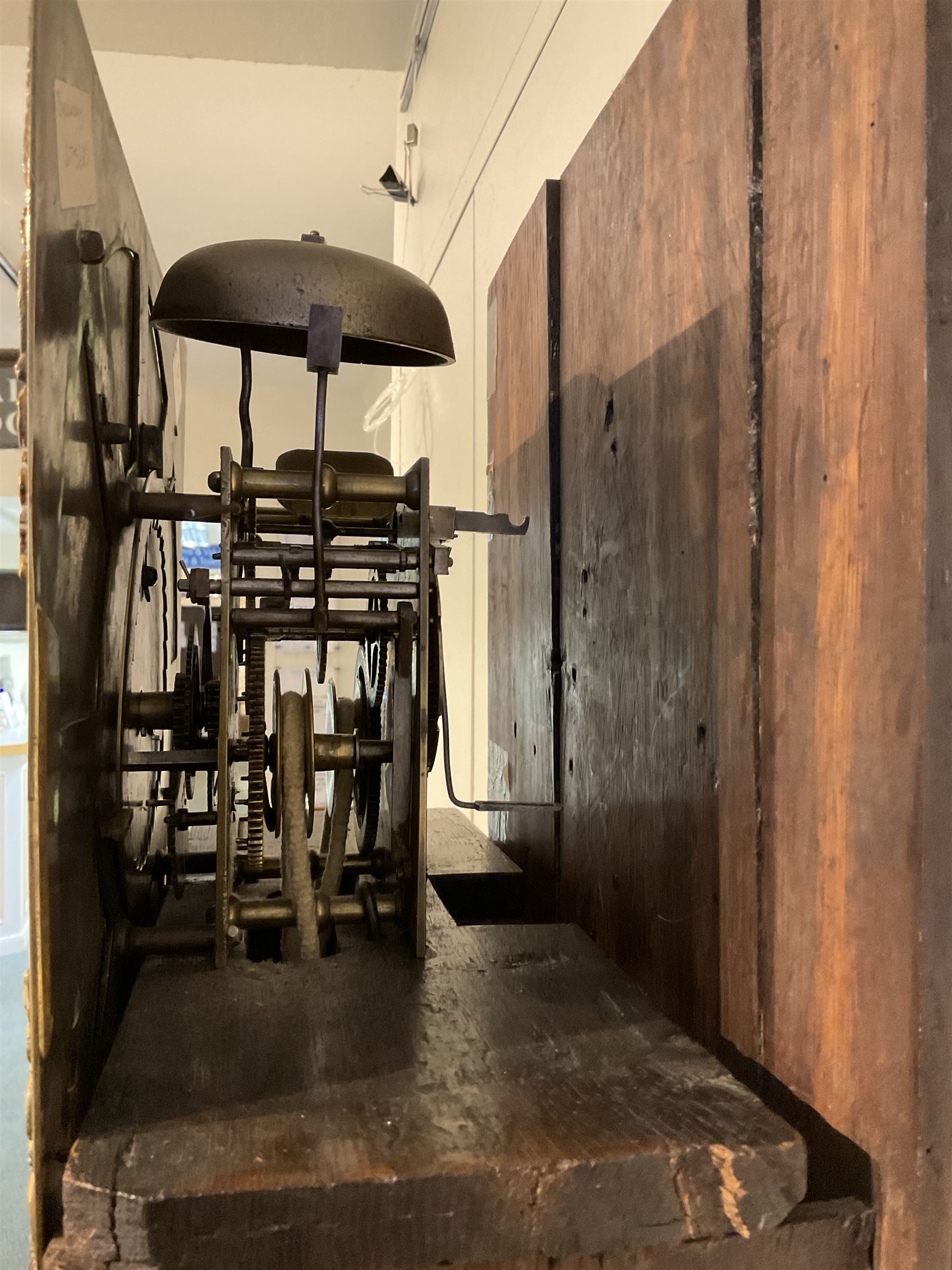 30-hour 18th century oak cased longcase clock by Jeremiah Standring of Bolton, (Lancs) c 1770, with a swan’s neck pediment on a flat top with a blind frieze beneath, square brass dial flanked by reeded pilasters and wooden capitals, long trunk door with a concave wavy top, trunk with reeded quarter columns on a rectangular plinth on a decorative skirting, dial with a formerly silvered chapter ring and engraved dial centre, with Roman numerals, five minute Arabic’s, square date aperture, circular boss engraved with the makers name, cast spandrels and “dummy” winding arbors, dial pinned directly to a rope driven countwheel striking movement, striking the hours on a bell. With weight and pendulum. 
30-hour clocks with “dummy” winding arbors are more commonly found on later 19th century painted dial longcase clocks, this is an earlier example by a recorded Lancashire clock maker born in Rochdale in 1712, dying in Bolton 1782.  

