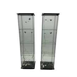 Two four sided glass display cabinets