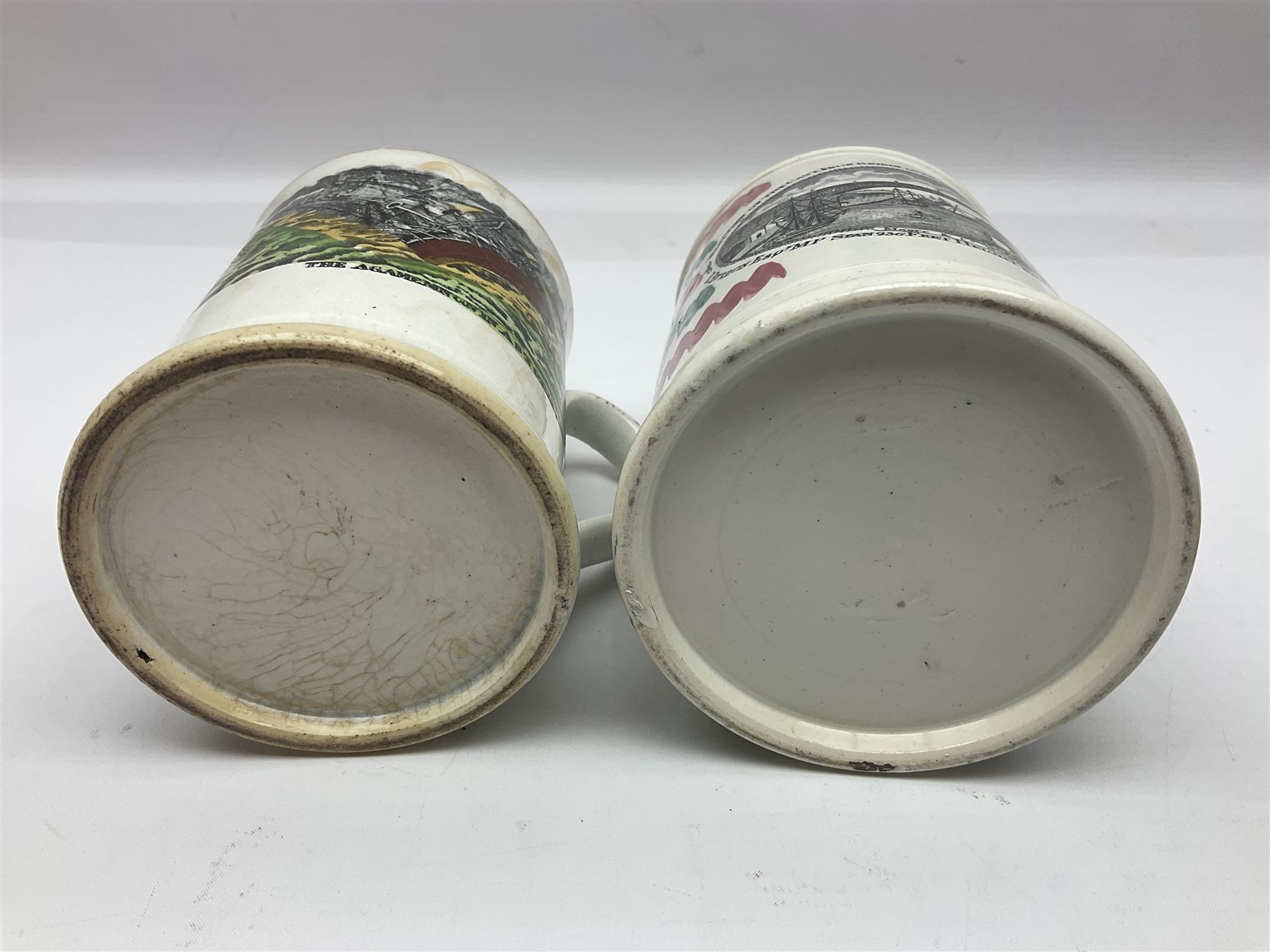 Staffordshire frog mug, depicting the ship Agamemnon in a storm, with lustre decoration and quote verso 'The sailor tost in stormy seas, though for his bark may roam, still hears a voice in every breeze, that wakens thoughts of home, he thinks upon his distant friends, his wife, his humble cot, and from his inmost heart ascends, the prayer Forget Me Not.', together with a similar later frog mug, depicting the 'west view of the cast iron bridge over the River Wear Sunderland', tallest H12.5cm