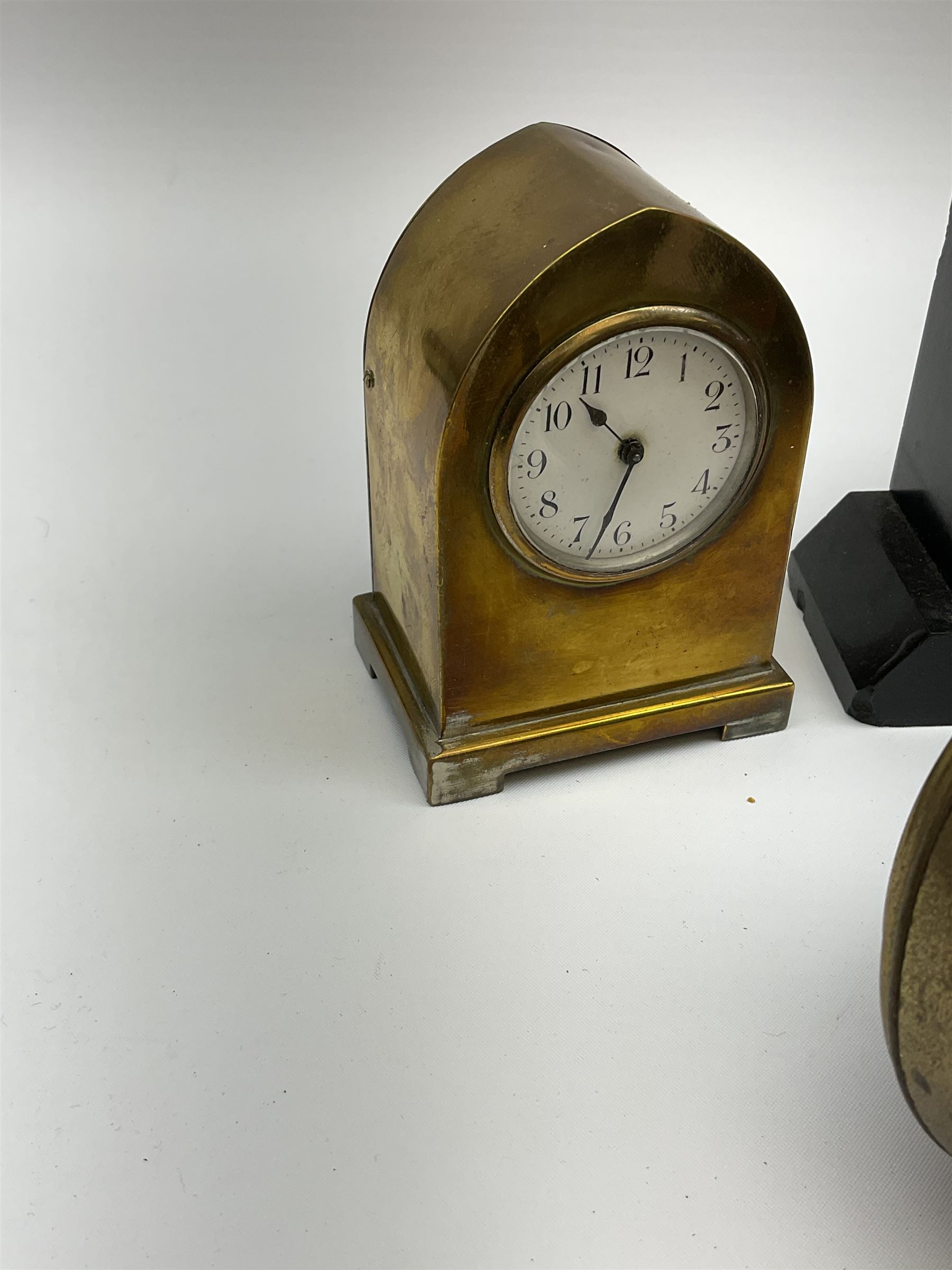 Miniature 'Zenith' travel alarm clock, in engine turned brass case with silvered numerical chapter ring, H5cm, together with other clocks to include Aynsley Portland Ware mantel clock, with moulded peacock design, Europa travelling clock, brass carriage clock, German copper clock of cube form etc