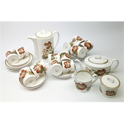 A Susie Cooper Nasturtium pattern tea service, comprising tea pot, coffee pot, six tea cups and six saucers, six coffee cans and six saucers, six side plates, milk jug, and lidded sucrier. 