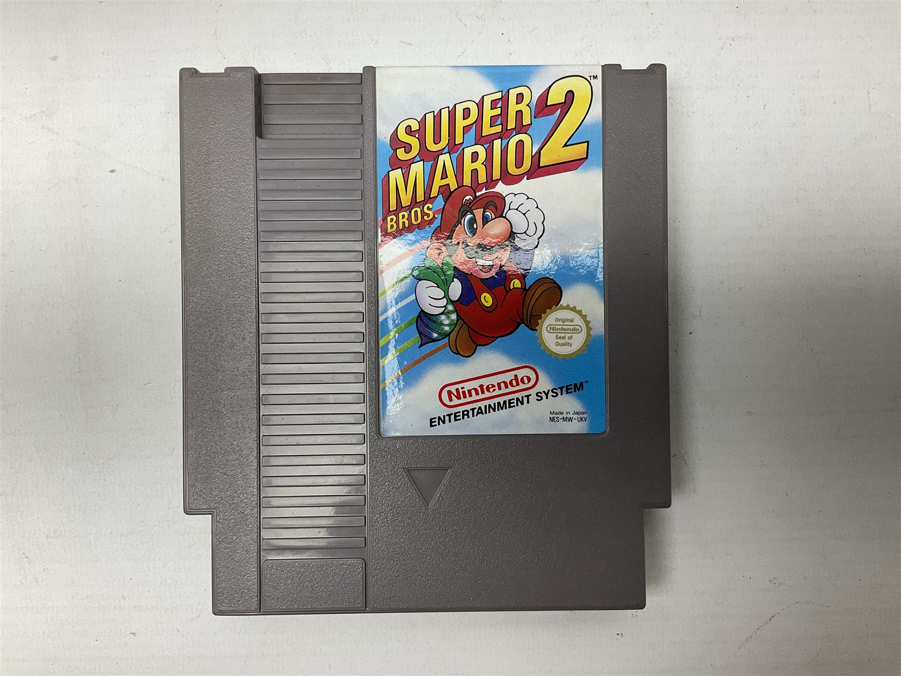 Nintendo Entertainment System (1985) console with two controllers, accessories and instruction booklet. NES Games ‘Duck Hunt’ with Nintendo Zapper gun, ‘Pinball’ and ‘Super Mario Bros.’, all with original sleeves and instruction booklets. NES game ‘Super Mario Bros. 2’ cartridge only