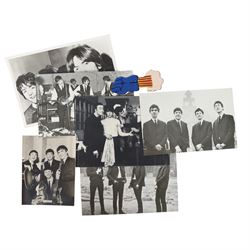 Beatles memorabilia, comprising John Lennon patch, nineteen Beatles chewing gum cards, collection of photographs and postcards including Eskimo Frozen Foods examples, two Beatles City carrier bags and Yellow Submarine cardboard cut-outs