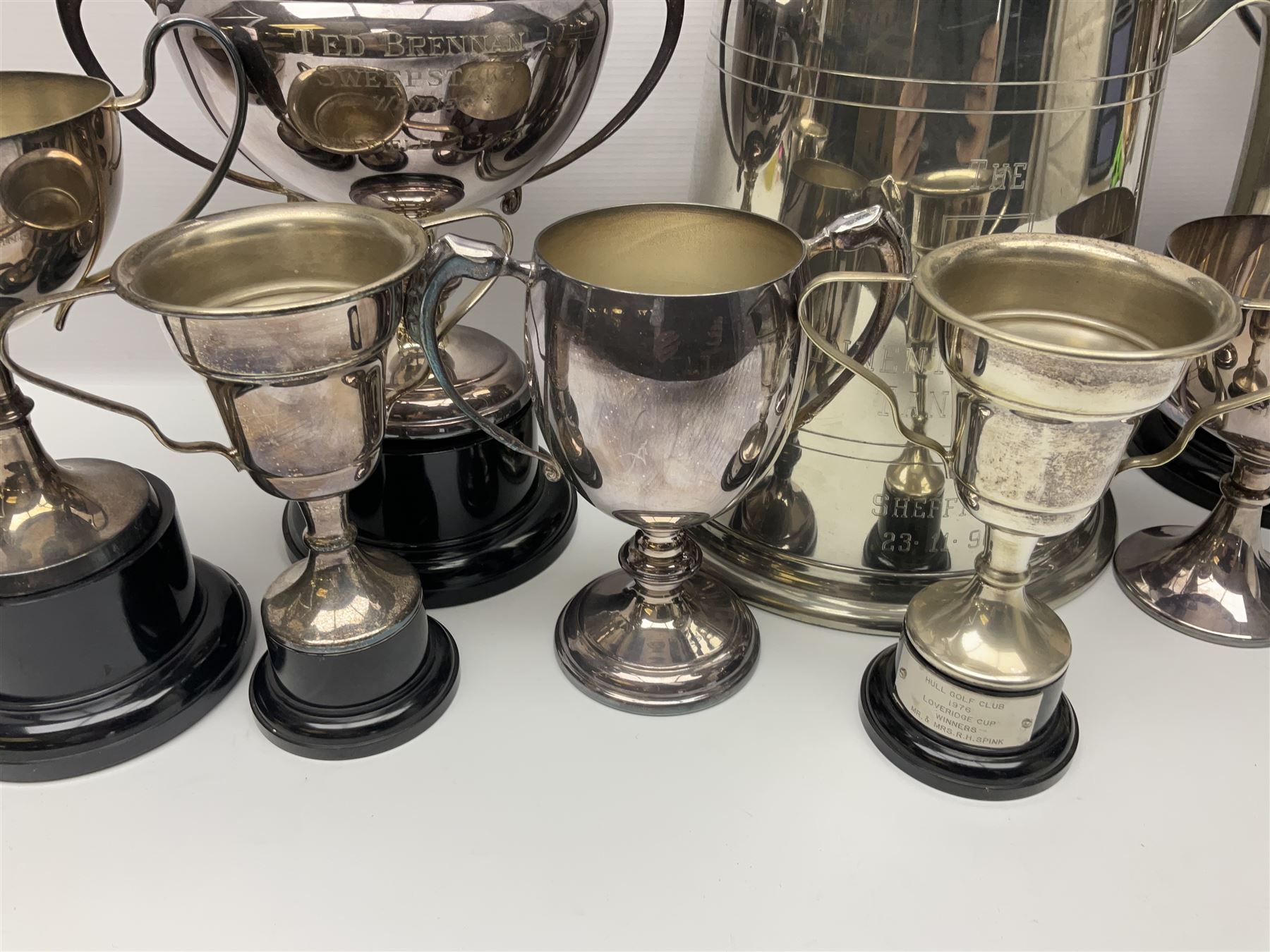 Collection of pewter and silver-plated trophy cups and presentation tankards, largest H28cm
