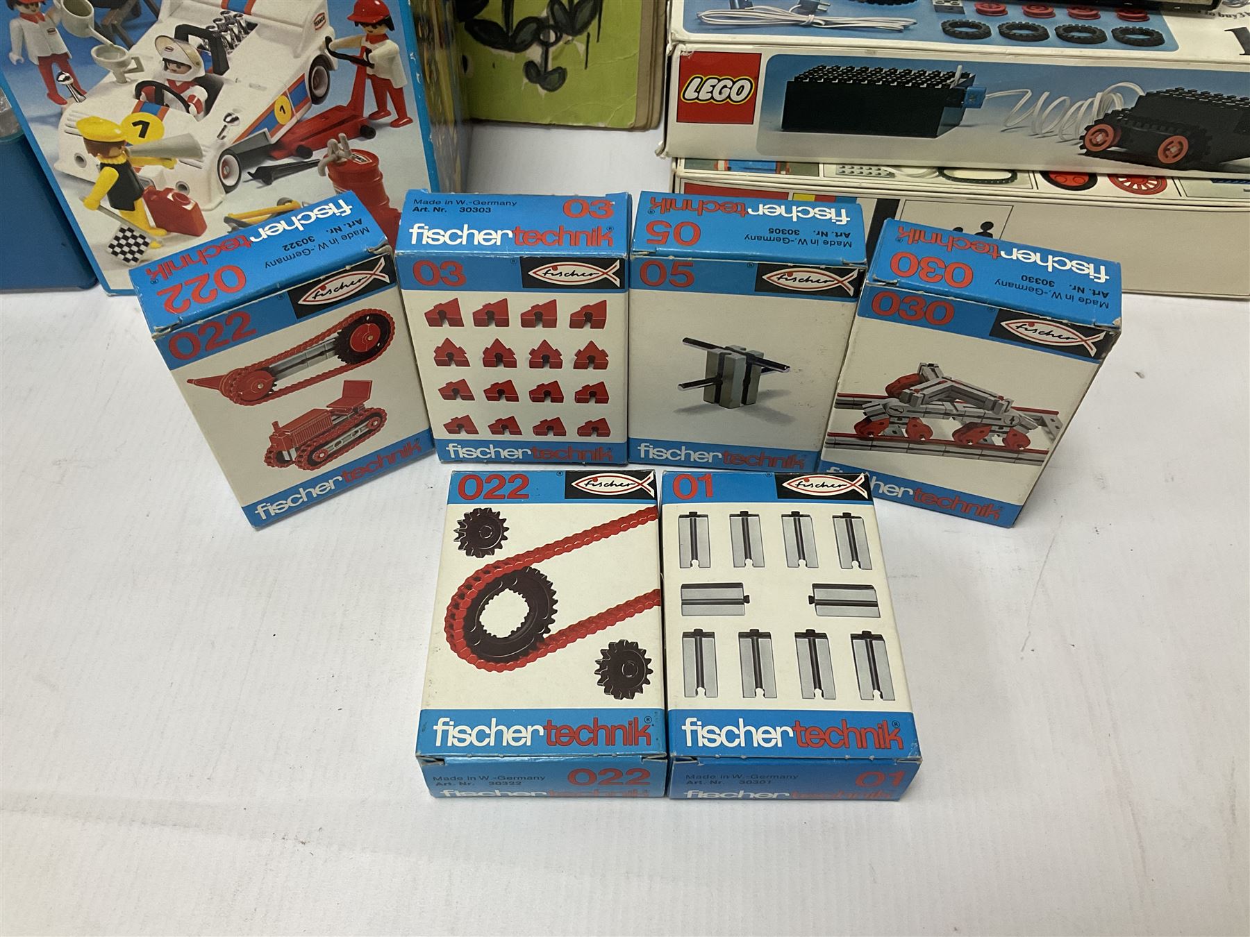Fischer Technik/Lego/Playmobil - thirteen model building sets comprising eight Fischer Technik sets 50, 50/1, 50v, 50/2, 50+mot1 and two 50S, 50/1 add-on pack, with spare parts packs 01, 03, 05, two 22 and 30; two Lego sets comprising C107 and Lego Systems 103, part-set 870 and 970; Playmobil no.3520 set; four boxes of loose lego, various instruction manuals and a scrapbook 