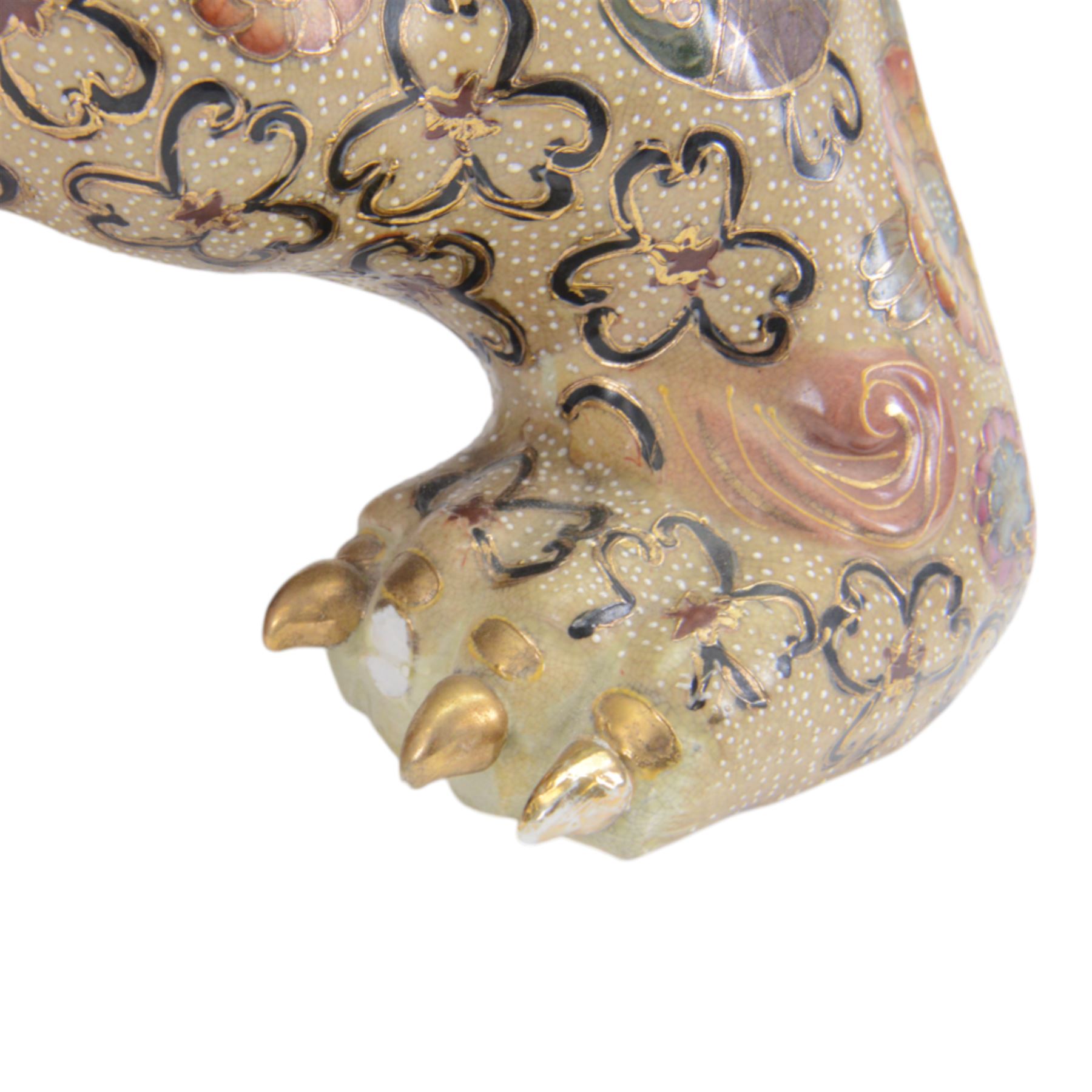 Temple Lion or Dog of Foo, modelled in seated post, one with one front paw resting upon a ball, with sword in mouth, H58cm