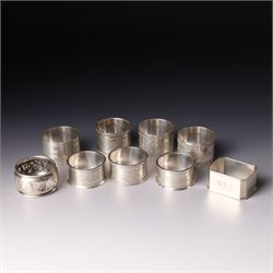 Pair of late Victorian silver napkin rings with engraved decoration Birmingham 1899 and se...