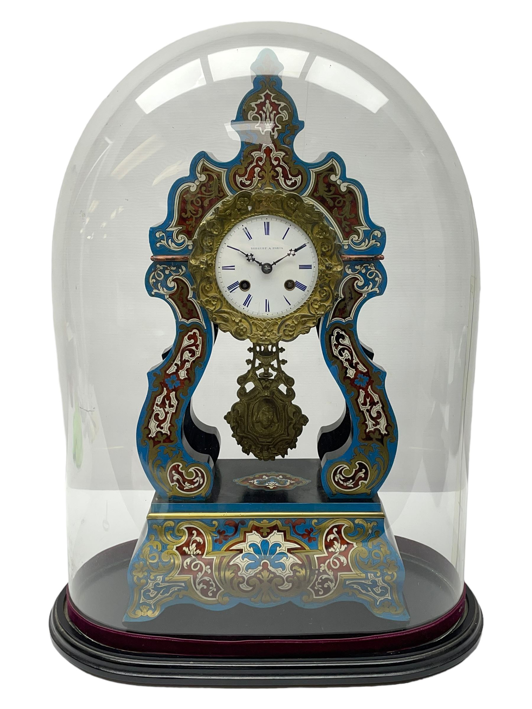 Breguet A Paris - Mid-19th century 8-day French portico clock, ebonised case with brass and cloisonne inlay, on a rectangular plinth with a shaped base, white enamel dial with blue Roman numerals, minute track and steel trefoil hands, cast brass bezel with scroll and foliate decoration and a conforming gridiron pendulum, twin train going barrel movement with a countwheel strike sounding the hours and half-hours on a bell, with an ebonised base and glass dome. 