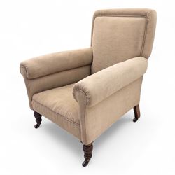 Late 19th century Howard style upholstered armchair, with deep seat and scroll arms, on turned front legs with brass and ceramic castors, the rear leg stamped Smith & Co Bristol No.302 