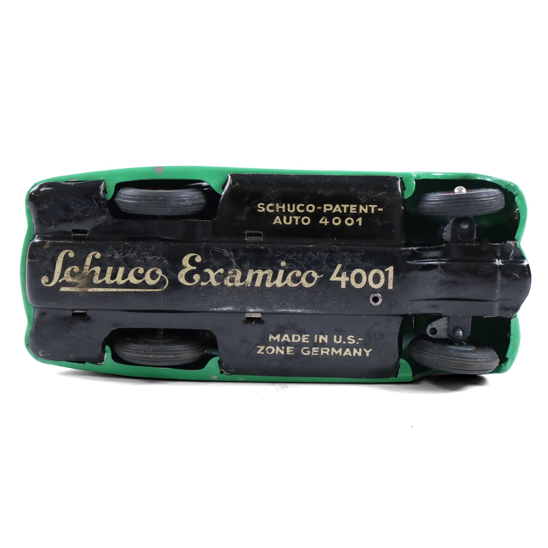 Schuco Examico 4001 tinplate clockwork car, in green with red interior, with key