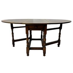19th century oak dining table, oval drop-leaf top on gate-leg action base, turned supports united by turned stretchers, fitted with single end drawer