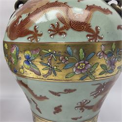 Pair of early 20th century Chinese vases decorated with dragons chasing a flaming pearl, with a gilt border of butterflies and floral sprigs, with Elephant head handles, H44cm 